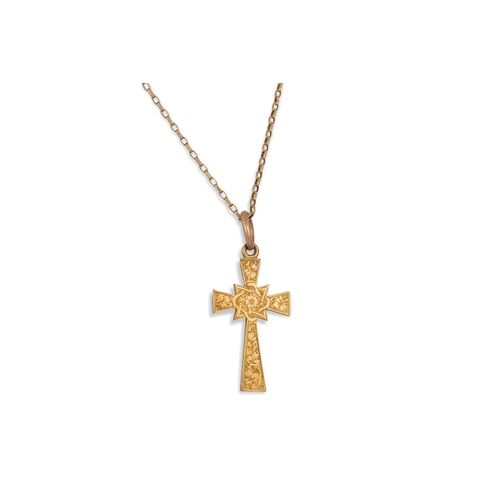 28 - A 9CT GOLD CROSS, on a chain