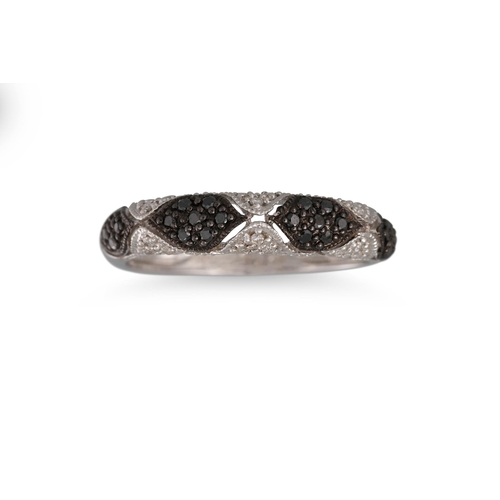 106 - A PAVÉ DIAMOND RING, set with black & white diamonds, mounted in 18ct white gold. Size M