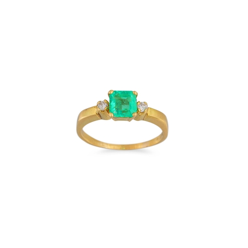 21 - AN EMERALD AND DIAMOND THREE STONE RING, mounted in 18ct gold, size N