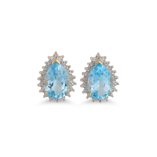 49 - A PAIR OF DIAMOND AND BLUE TOPAZ EARRINGS, the oval topaz to diamond surround mounted in gold