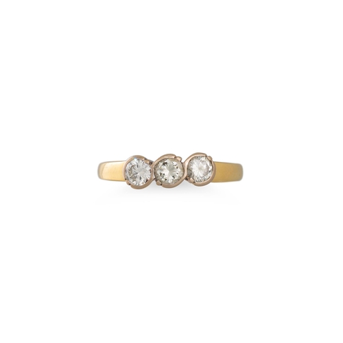 1 - A THREE STONE DIAMOND RING, the brilliant cut diamonds mounted in a 18ct yellow gold rub over settin... 