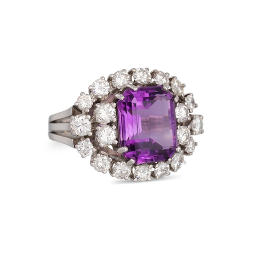 110 - AN AMETHYST AND DIAMOND RING, the rectangular amethyst to a brilliant cut diamond surround, mounted ... 