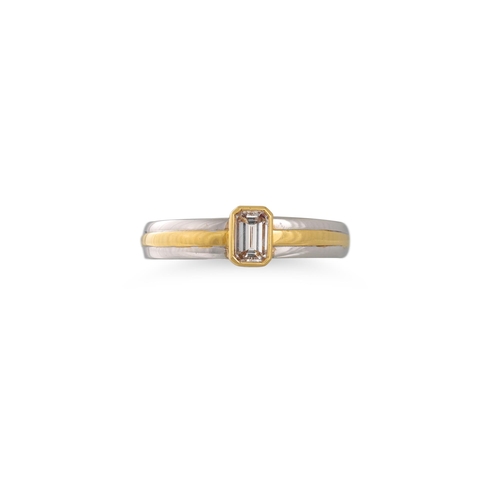 189 - A DIAMOND SOLITAIRE RING, the emerald cut diamond mounted in 18ct white and yellow gold. Estimated: ... 