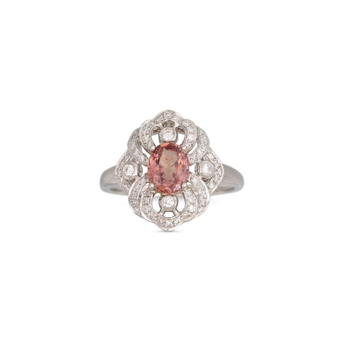 236 - A PADPARADSCHA SAPPHIRE AND DIAMOND CLUSTER RING, the oval sapphire to shaped diamond surround mount... 