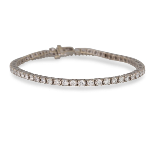 264 - A DIAMOND LINE BRACELET, the round brilliant cut diamonds set in 14ct white gold. Estimated: weight ... 