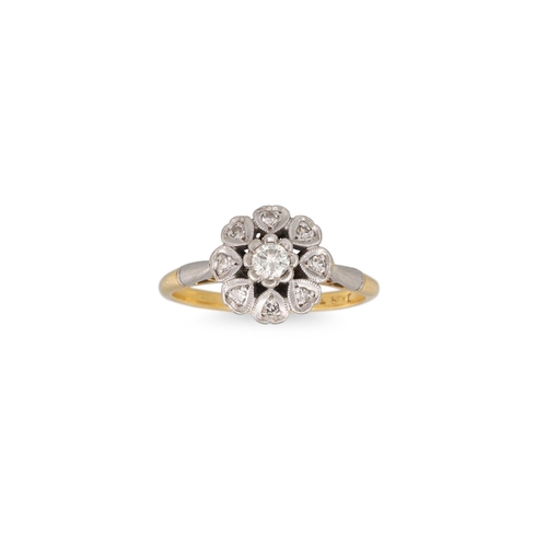 286 - A VINTAGE DIAMOND DAISY CLUSTER RING, mounted in platinum and 18ct gold. Estimated: weight of diamon... 