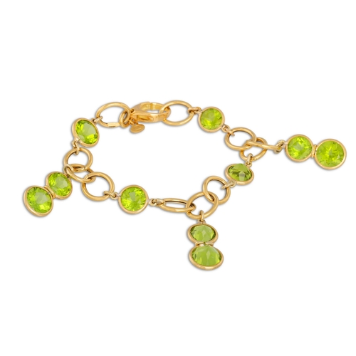 296 - A PERIDOT BRACELET, the circular peridots suspended from yellow gold links. Estimated: weight of per... 