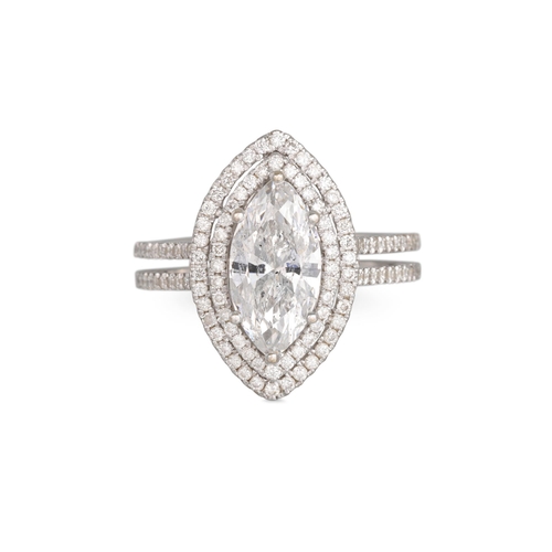 372 - A DIAMOND CLUSTER RING, the marquise diamond to a double row diamond surround, split diamond set sha... 