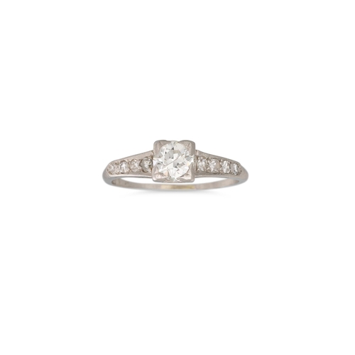 374 - A VINTAGE DIAMOND SOLITAIRE RING, the old cut diamond to diamond shoulders, mounted in white gold. E... 