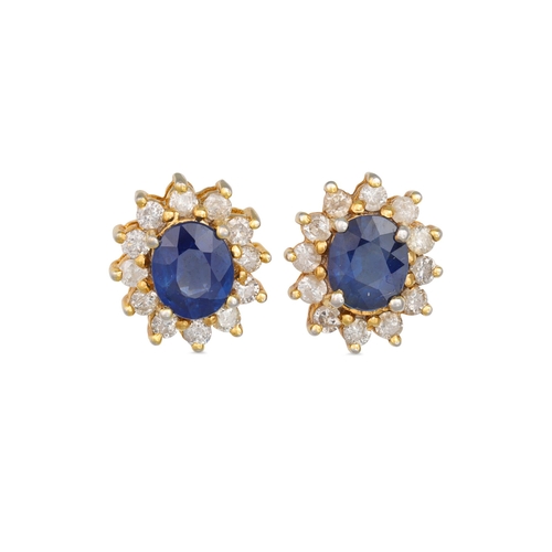 66 - A PAIR OF DIAMOND AND SAPPHIRE CLUSTER EARRINGS, the oval sapphires to diamond surrounds, mounted in... 