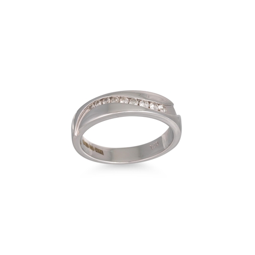 13 - A CHANNEL SET DIAMOND RING, mounted in 9ct white gold. Size: M