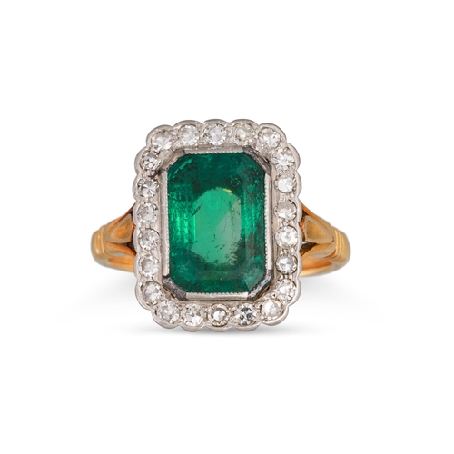 139 - AN EMERALD AND DIAMOND CLUSTER RING, the rectangular emerald to a diamond surround, mounted in yello... 