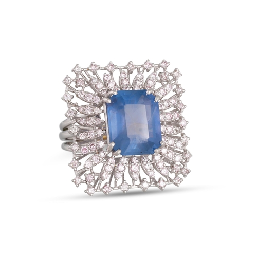 150 - A SAPPHIRE AND PINK DIAMOND RING, the large princess cut sapphire to diamond surround, of square for... 