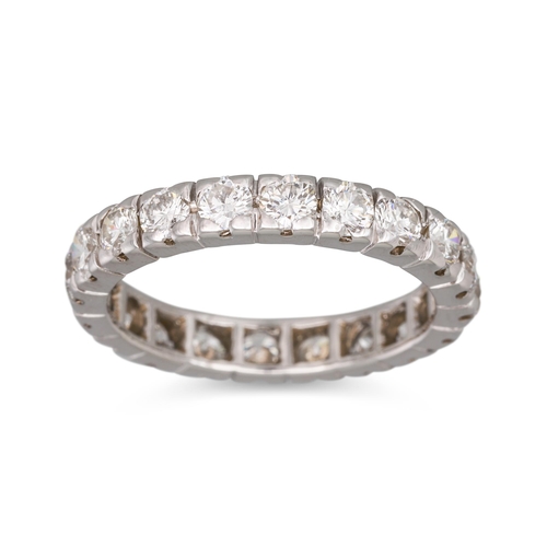 156 - A DIAMOND ETERNITY RING, the brilliant cut diamonds mounted in white metal. Estimated: weight of dia... 