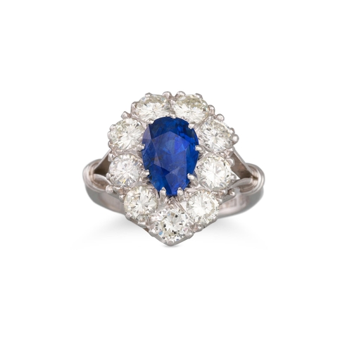 159 - A DIAMOND AND SAPPHIRE CLUSTER RING, pear shaped sapphire to brilliant cut diamond surround, togethe... 