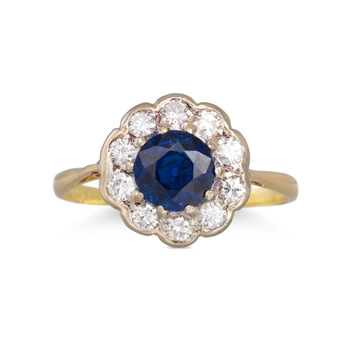 160 - A SAPPHIRE AND DIAMOND CLUSTER RING, of circular form. Estimated: weight of diamonds: 0.30 ct. sapph... 