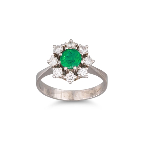 161 - AN EMERALD AND DIAMOND CLUSTER RING, of circular form. Estimated: weight of emerald: 0.59 ct. diamon... 