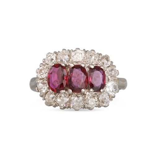 168 - A RUBY AND DIAMOND CLUSTER RING, the three oval rubies to diamond surround, mounted in platinum. Est... 