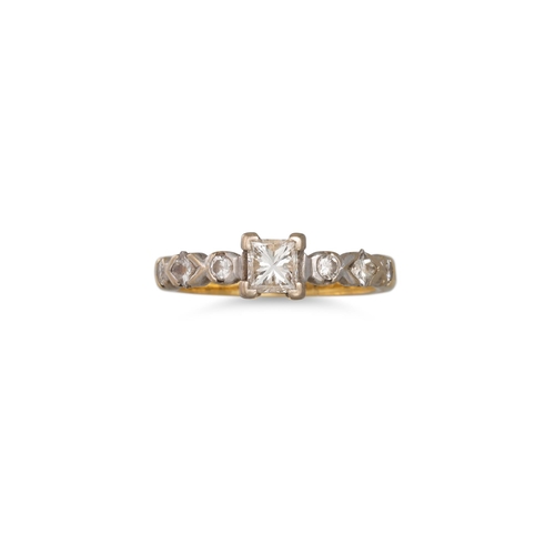 17 - A DIAMOND SOLITAIRE RING, the princess cut stone to diamond set shoulders, mounted in 18ct yellow go... 