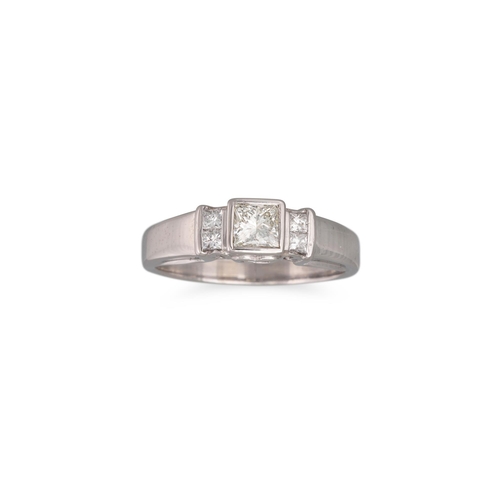 184 - A DIAMOND SOLITAIRE, RING, the princess cut diamond to princess cut diamond set shoulders, mounted i... 