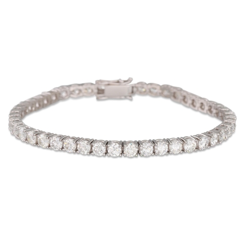 186 - A DIAMOND LINE BRACELET, the round brilliant cut diamonds mounted in18ct white gold. Estimated: weig... 