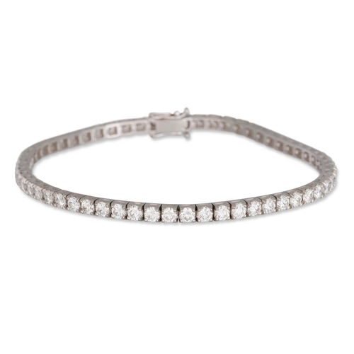 187 - A DIAMOND LINE BRACELET, the round brilliant cut diamonds mounted in 18ct white gold. Estimated: wei... 