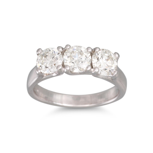 191 - A DIAMOND THREE STONE RING, the brilliant cut diamonds mounted in 18ct white gold. Estimated: weight... 