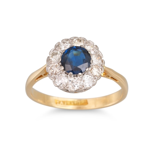 213 - A SAPPHIRE AND DIAMOND CLUSTER RING, the circular sapphire to brilliant cut diamond surround, mounte... 