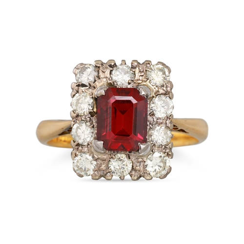 214 - A GARNET AND DIAMOND CLUSTER RING, the rectangular stone to brilliant cut diamond surround, mounted ... 