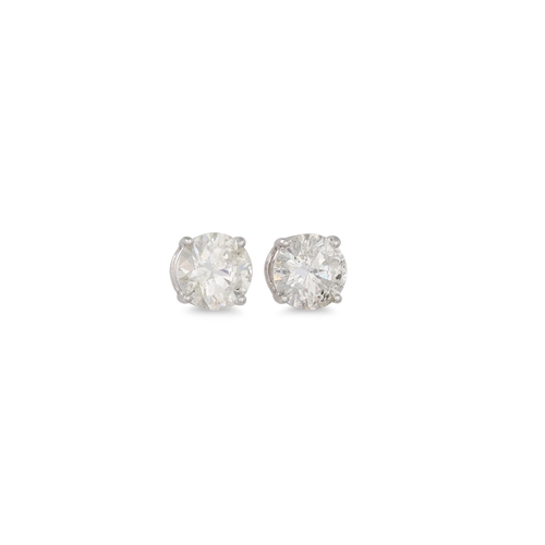 242 - A PAIR OF DIAMOND STUD EARRINGS, the brilliant cut diamonds mounted in 18ct white gold.Together with... 