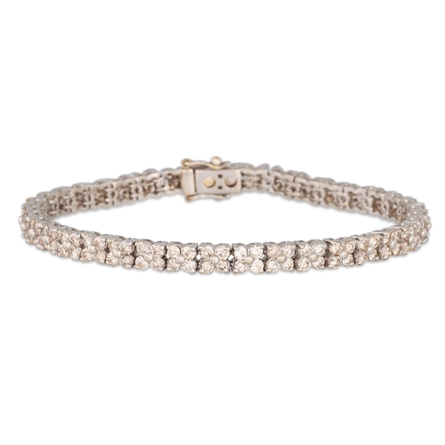 25 - A DIAMOND LINE BRACELET, mounted in white gold. Estimated: weight of diamonds: 5.00 ct.