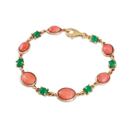 257 - A CORAL AND EMERALD BRACELET, the oval corals to smaller round emeralds, mounted in yellow gold