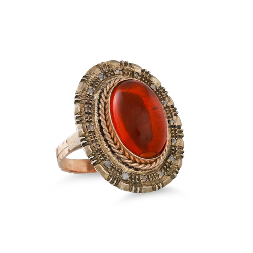 263 - AN AMBER AND DIAMOND RING, the oval amber to old cut diamond surround, mounted in antique 12ct yello... 