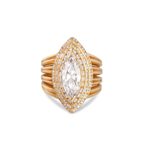 264 - A DIAMOND CLUSTER RING, the marquise diamond to a tiered diamond surround, mounted in yellow gold. E... 