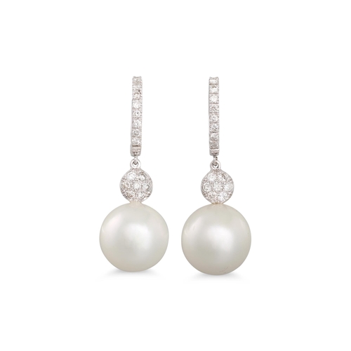 274 - A PAIR OF SOUTH SEA PEARL AND DIAMOND DROP EARRINGS, the diamond half hoop to a pearl drop, mounted ... 