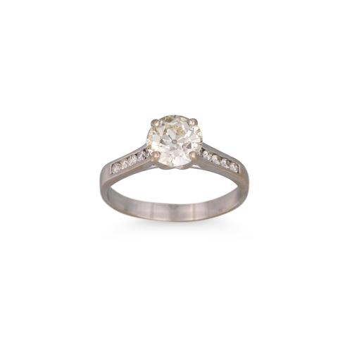 286 - A DIAMOND SOLITAIRE RING, the old cut European stone to diamond shoulders, mounted in 18ct white gol... 