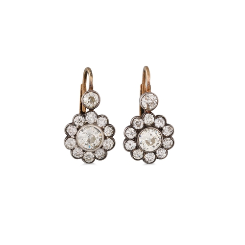 301 - A PAIR OF ANTIQUE DIAMOND DROP CLUSTER EARRINGS, of 'daisy' form, mounted in white and yellow gold. ... 