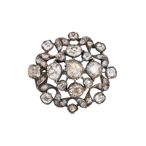 305 - A DIAMOND CLUSTER BROOCH, the rose cut diamonds mounted in silver. Estimated: weight of diamonds: 5.... 