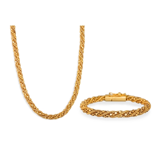 321 - AN 18CT YELLOW GOLD FANCY LINK NECKLACE, and matching bracelet, 108 g.