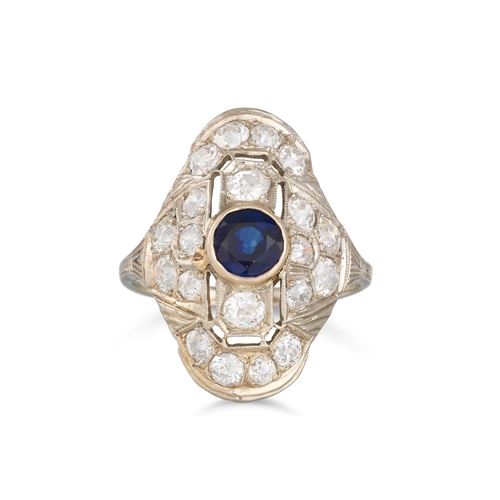 332 - A SAPPHIRE AND DIAMOND RING, of plaque form, the circular sapphire to an old cut diamond surround, s... 