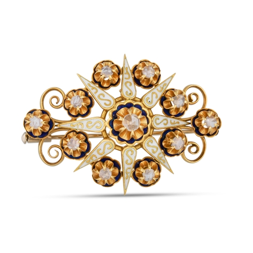 335 - A DIAMOND AND EMERALD BROOCH, of star burst form, in 18ct yellow gold