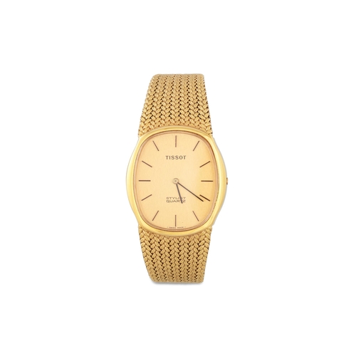 351 - A MID SIZE SLIM LINE TISSOT STYLIST QUARTZ WRISTWATCH, in gold plate, champagne face with baton mark... 