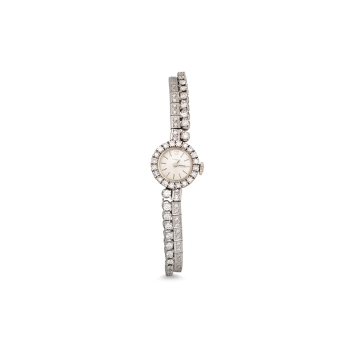 367 - A VINTAGE LADY'S DIAMOND SET COCKTAIL WATCH, by Tissot, with diamond bezel and strap in 18ct white g... 