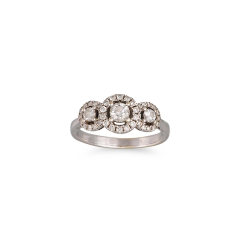 53 - A DIAMOND THREE STONE CLUSTER RING, the brilliant cut diamonds to a diamond halo surround, mounted i... 