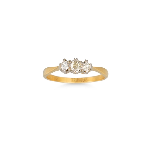 57 - A DIAMOND THREE STONE RING, mounted in 18ct yellow gold and platinum. Estimated: weight of diamonds:... 