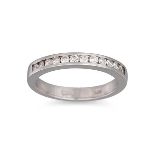 87 - A DIAMOND HALF ETERNITY RING, channel set in 18ct white gold, 4.6 g., size M - N. Estimated: weight ... 