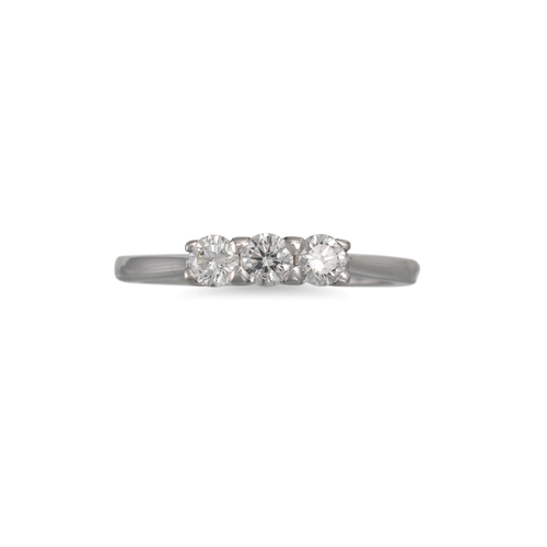 24 - A DIAMOND THREE STONE RING, the round brilliant cut diamonds mounted in 18ct white gold. Estimated: ... 