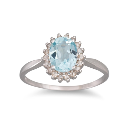 27 - A DIAMOND AND TOPAZ CLUSTER RING, the oval topaz to diamond surround, mounted in 9ct gold, size O