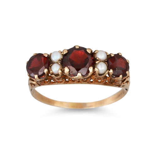 29 - A GARNET AND PEARL RING, set with three garnets to pearl spacers, mounted in 9ct gold, size T - U