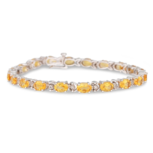 33 - A DIAMOND AND CITRINE BRACELET, mounted in white gold